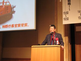 独自戦略を語る筑水キャニコム会長の包行氏